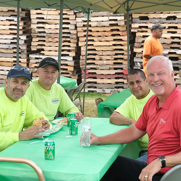 Kamps employees enjoying lunch together sitting at table